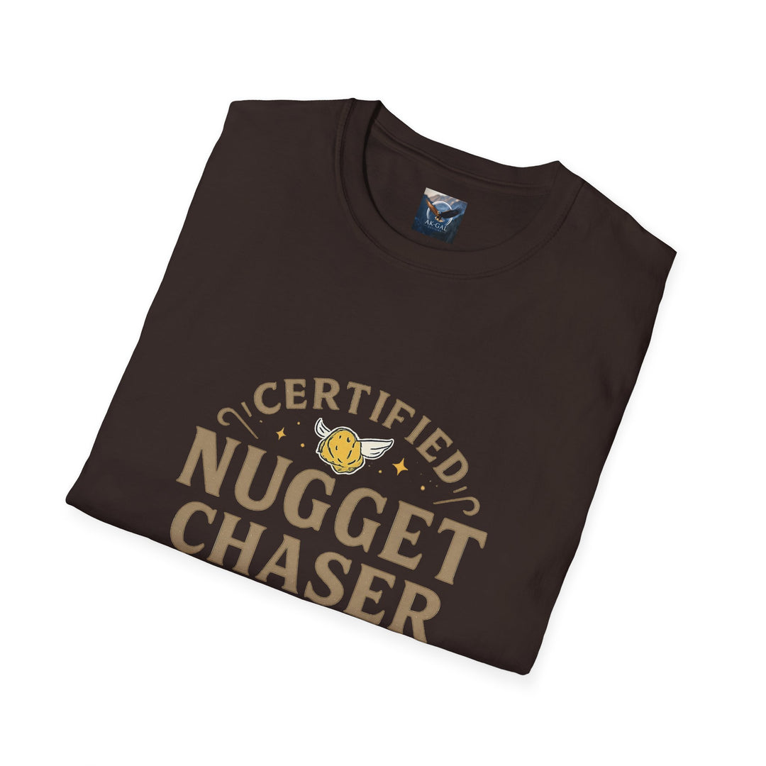 Folded brown t-shirt with 'Certified Nugget Chaser' text with brand label featuring Ak Gal Designs