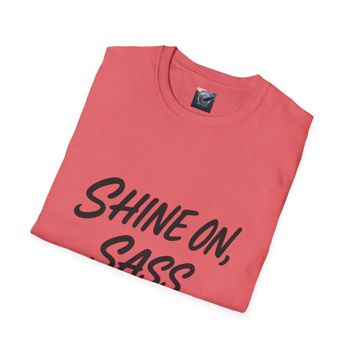 Folded pink t-shirt with 'SHINE ON, SASS' text 