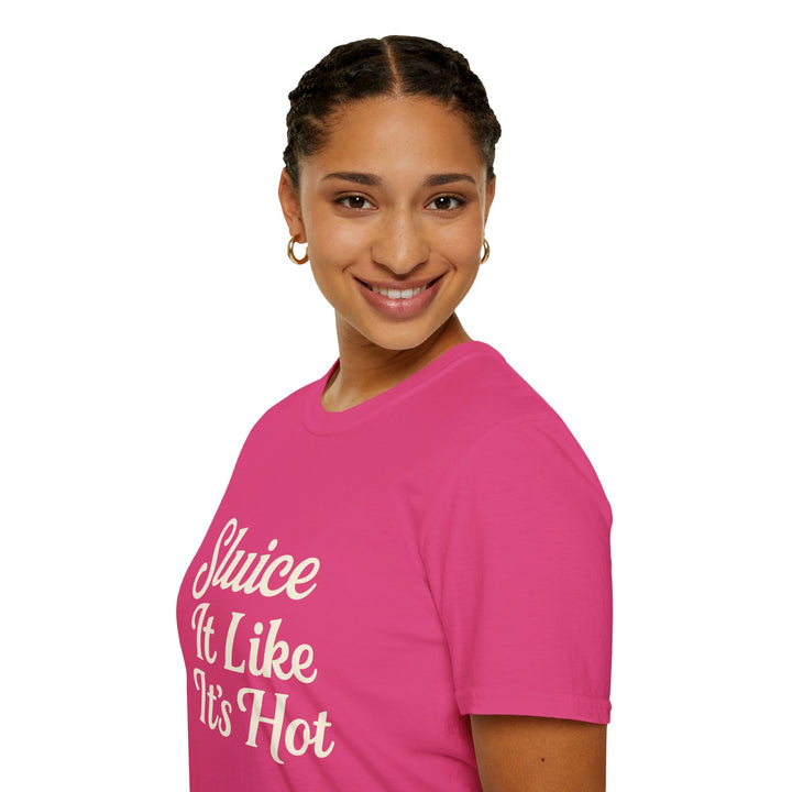 Female model wearing a pink t-shirt with text Sluice It Like It’s Hot, side view