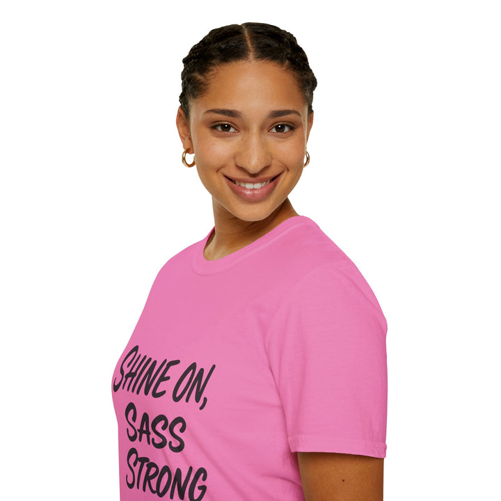Female model wearing a pink Shine On, Sass Strong, t-shirt, side view