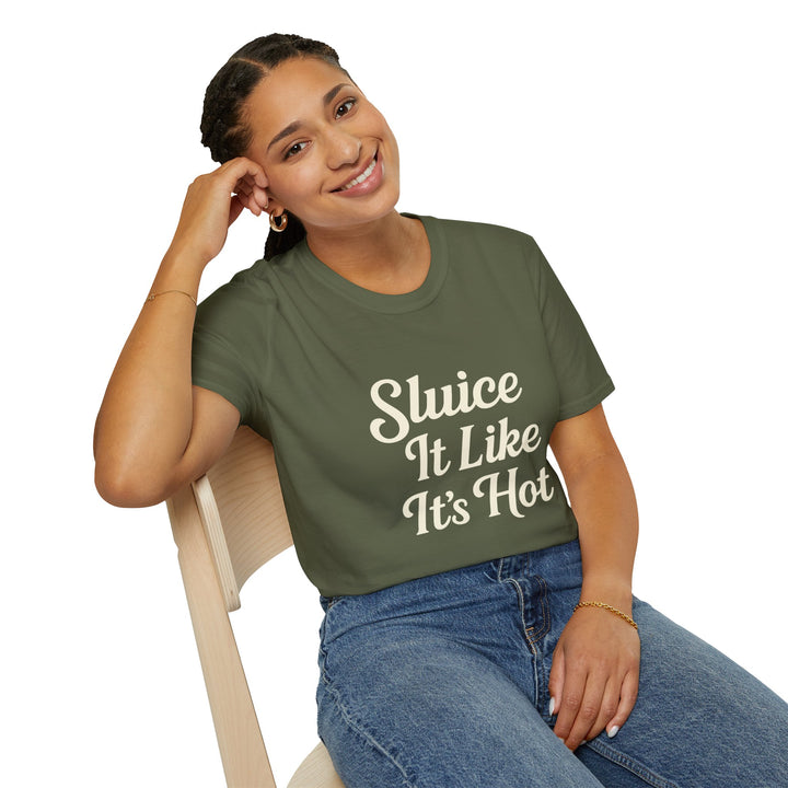 Female model wearing a green t-shirt with 'Sluice It Like It's Hot' text, sitting on a chair.
