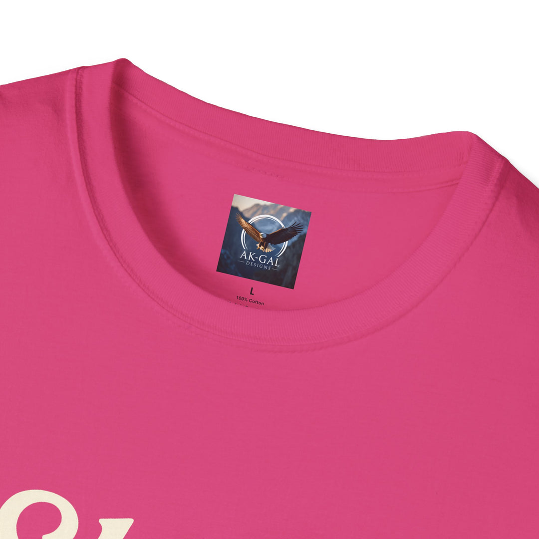 Close-up of a pink t-shirt with a brand label Ak Gal Designs