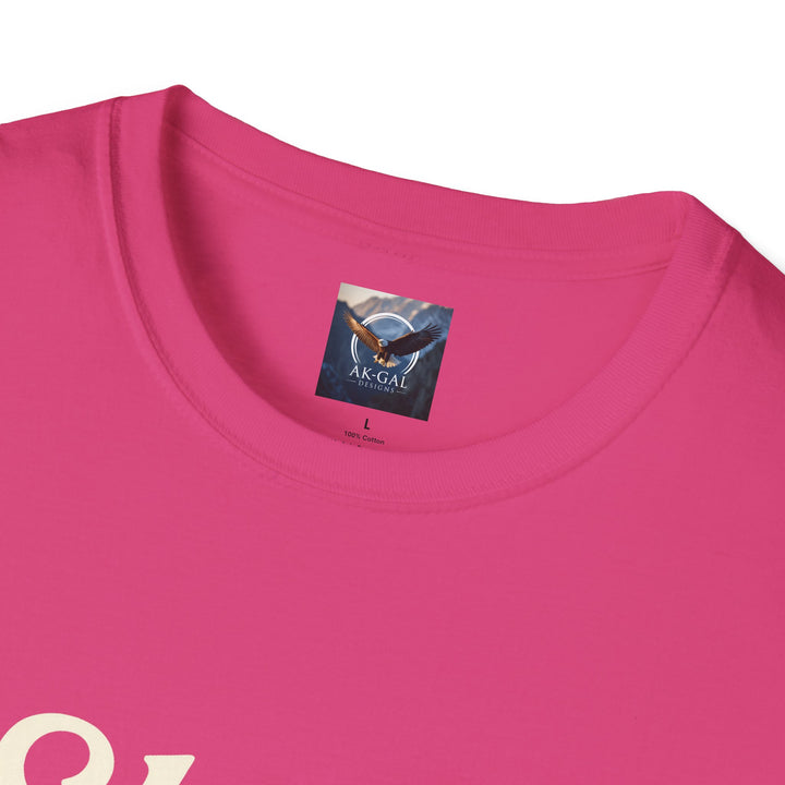 Close-up of a pink t-shirt with a brand label Ak Gal Designs